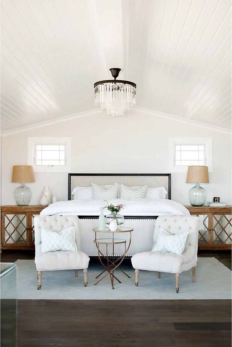 Using bedside tables to usher in wooden element into the white bedroom