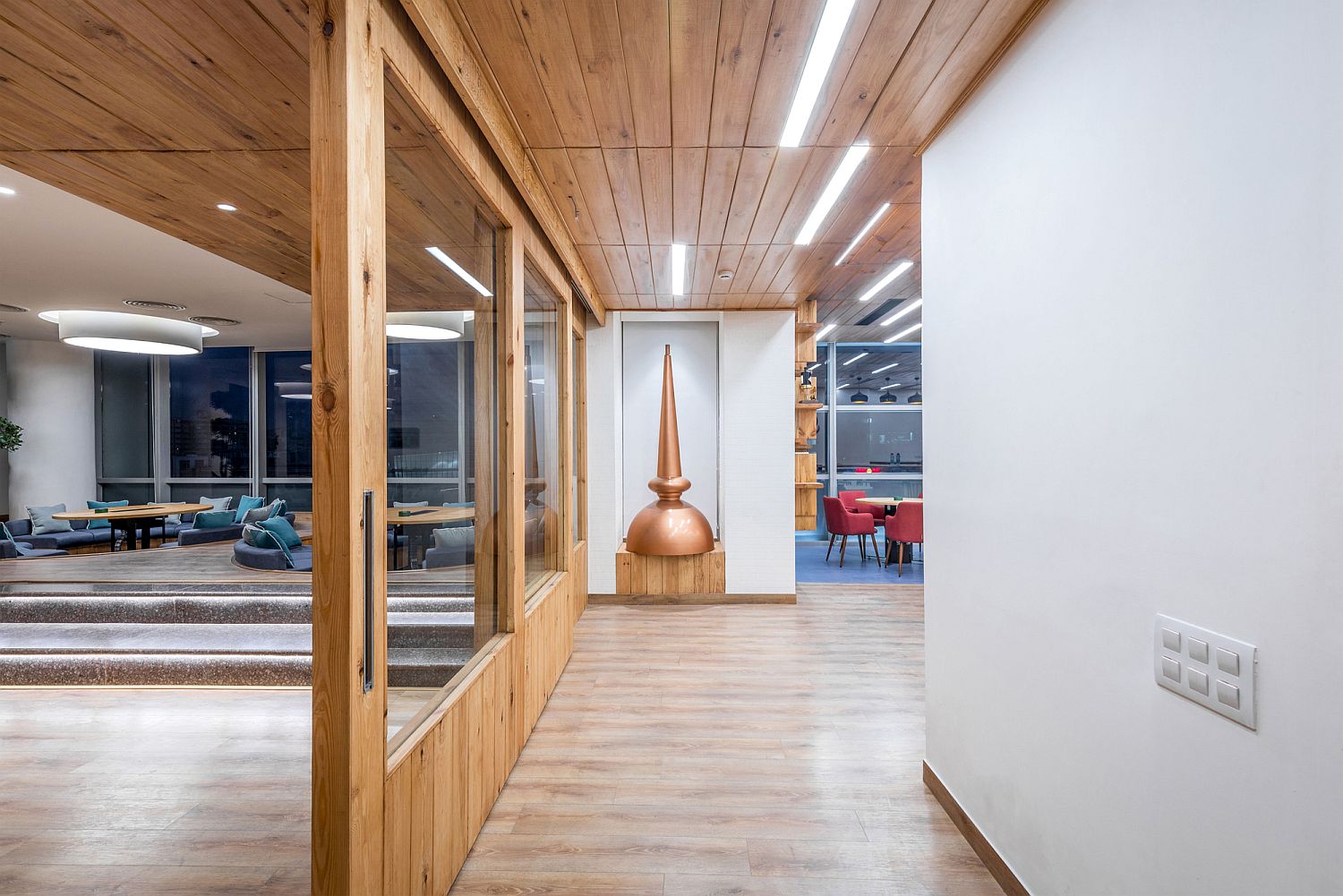 Wooden-elements-borrowed-from-distillery-add-warmth-to-the-office-area