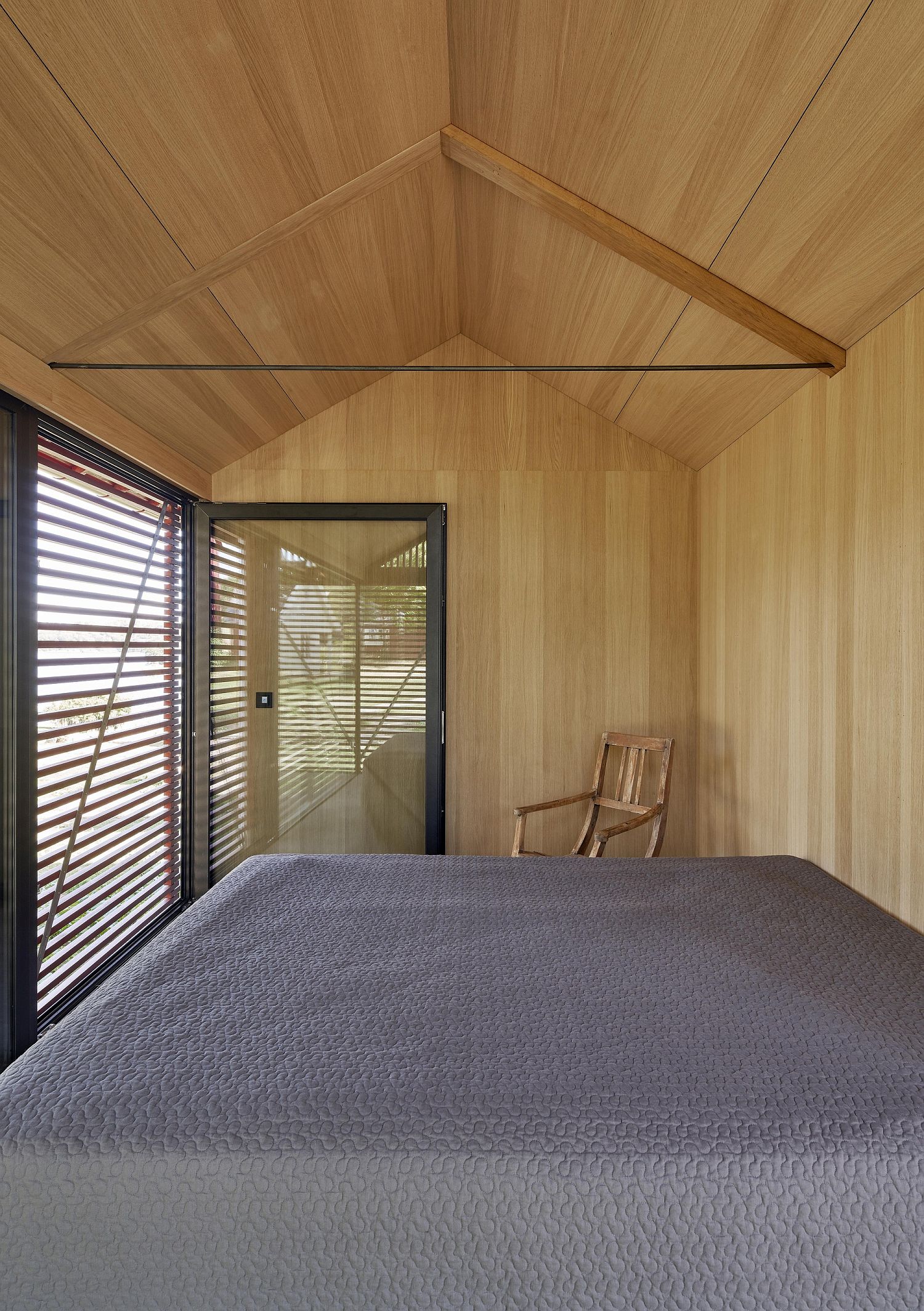 Woodsy bedroom of the cabin is protected from the elements