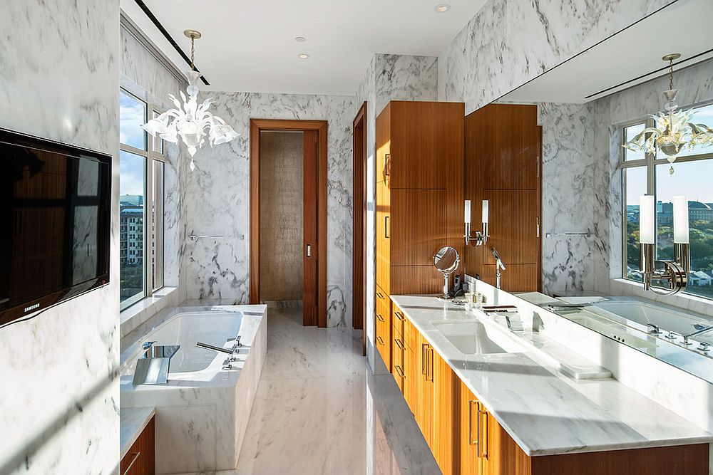 Balance between white and wood inside the bathroom draped in marble