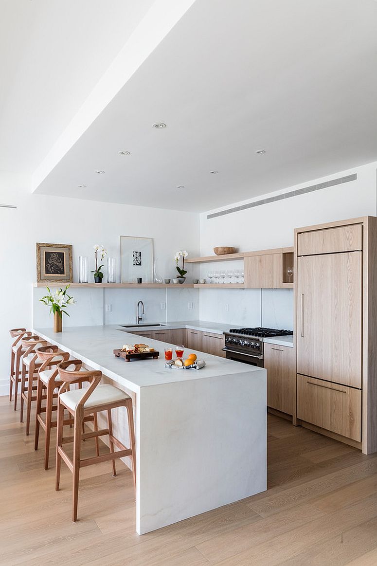 Bar stools add more woodsy charm to this spacious kitchen