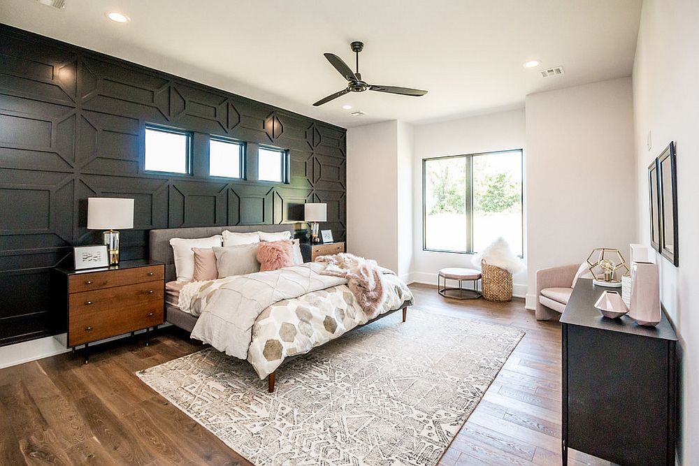 Black accent wall brings both contrast and pattern to this bedroom