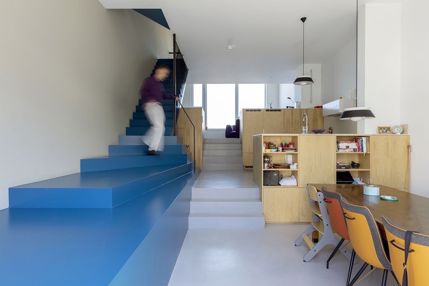 Blue takes over the interior as well with a striking staircase