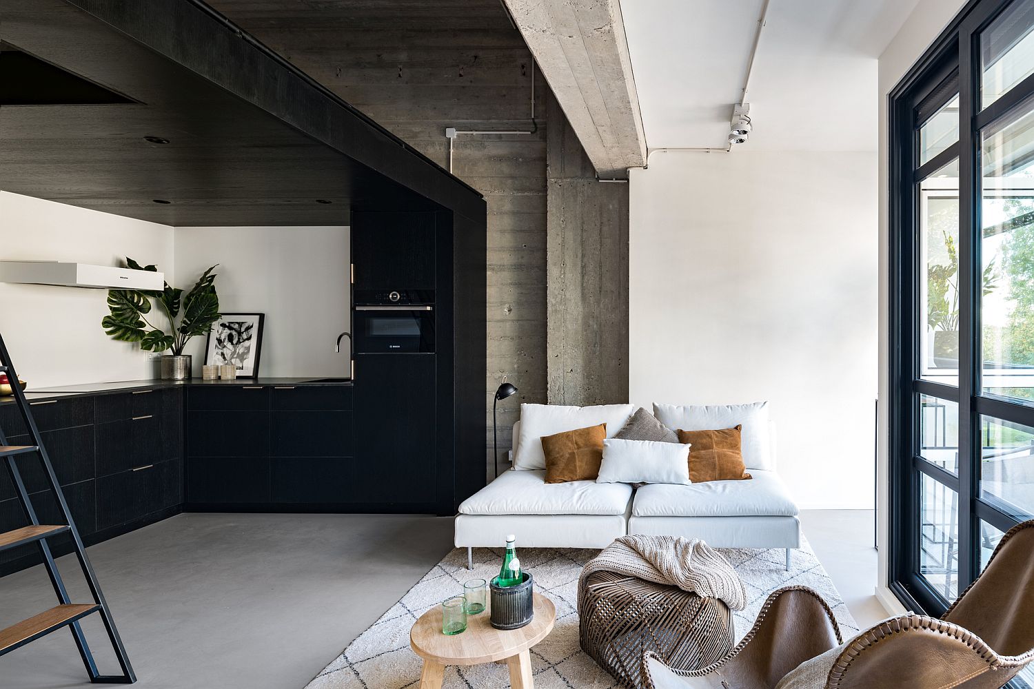 Combining raw concrete with polished modern finishes inside the posh loft