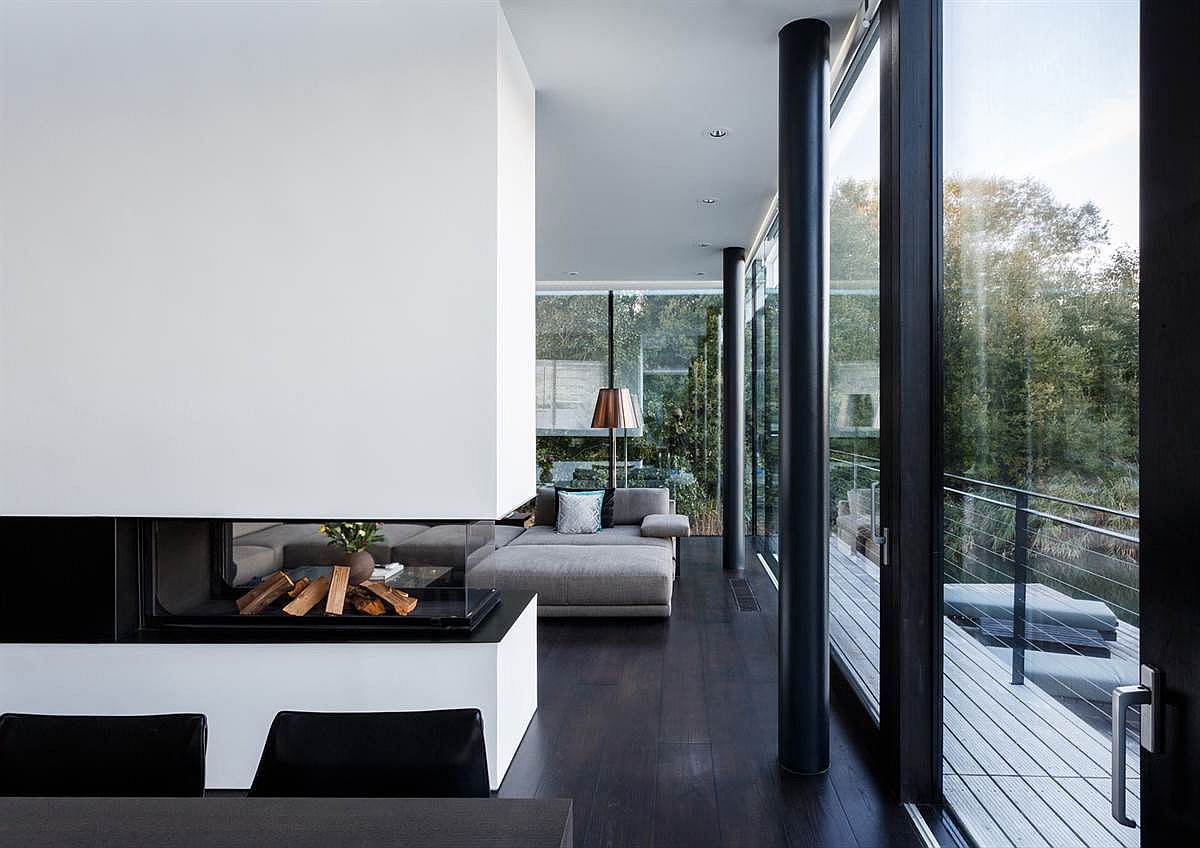 Contemporary interiors of the lake house with white and steel palette