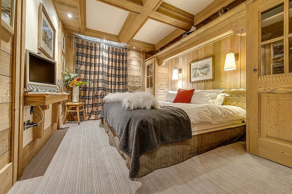 Cozy and modern bedroom of chalet Montana in the French Alps