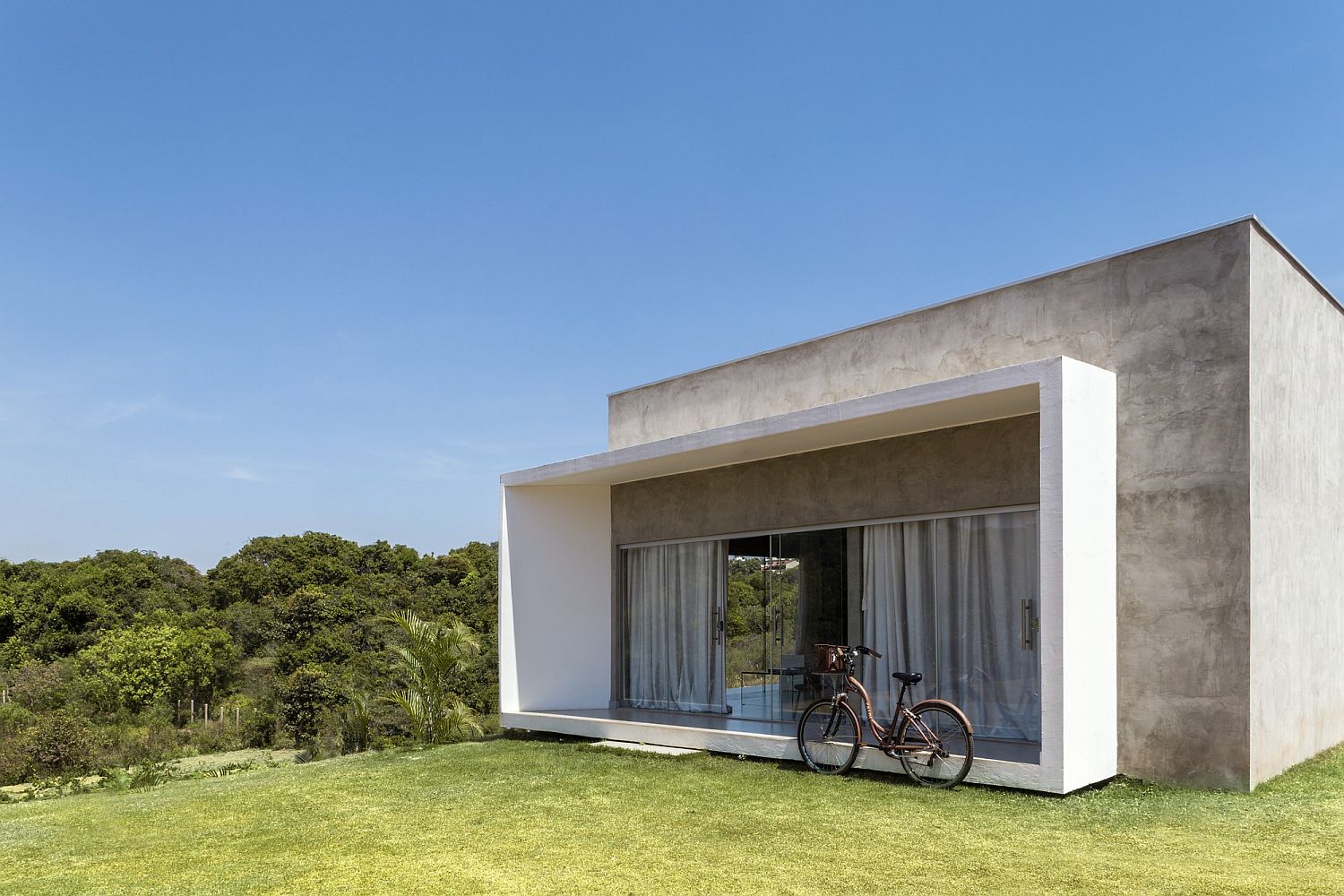 Drapes and sliding glass doors combine privacy with smart views