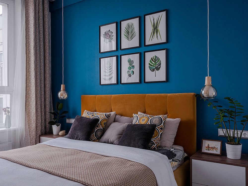 Fabulous blue accent walls in the modern bedroom with framed botanical to highlight it further