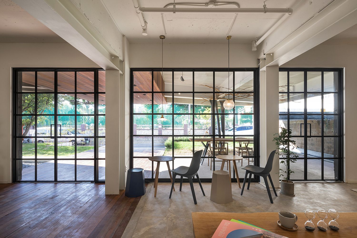 Framed glass windows of the cafe with a view of the garden