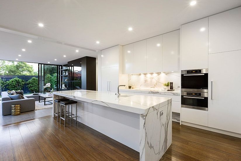 Let the floor bring a bit of woodsy warmth to the all-white kitchen