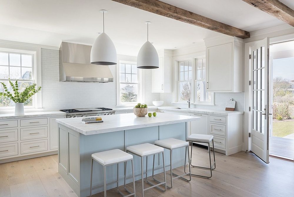 Light pastel blue becomes one with white in this kitchen