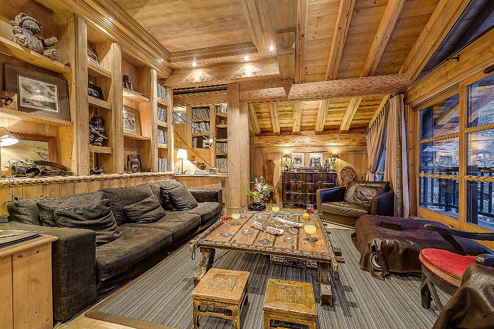 Living area of the chalet with multiple seating options and a luxurious ambiance