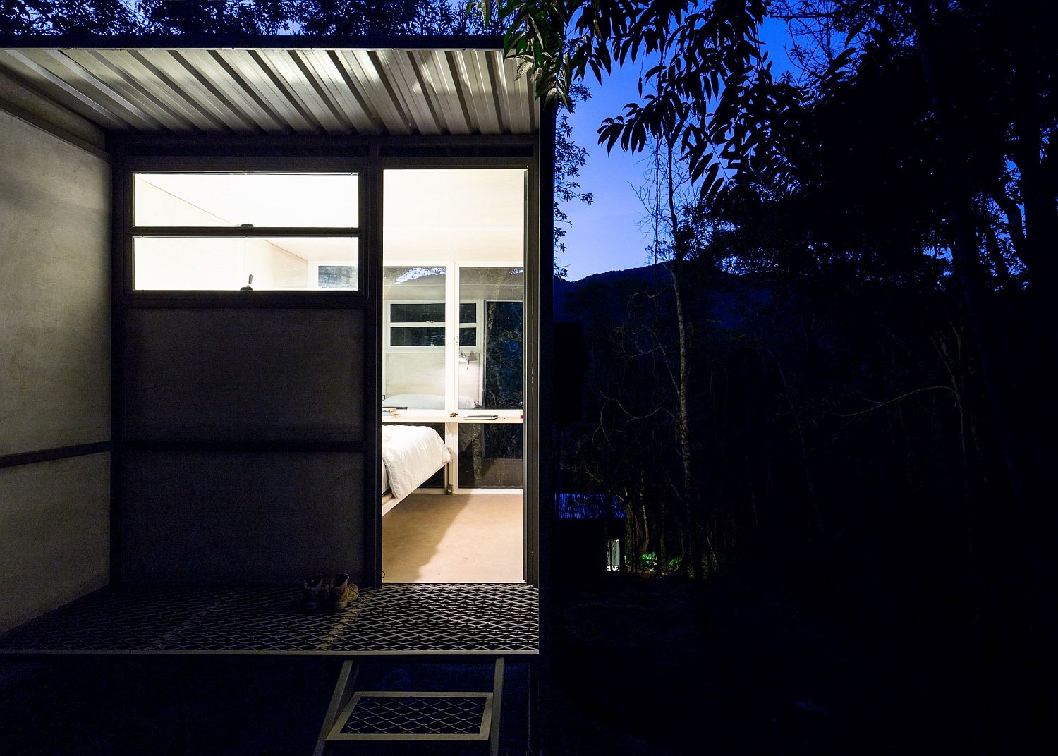 Metal and wood shape the tiny cabin in the forest