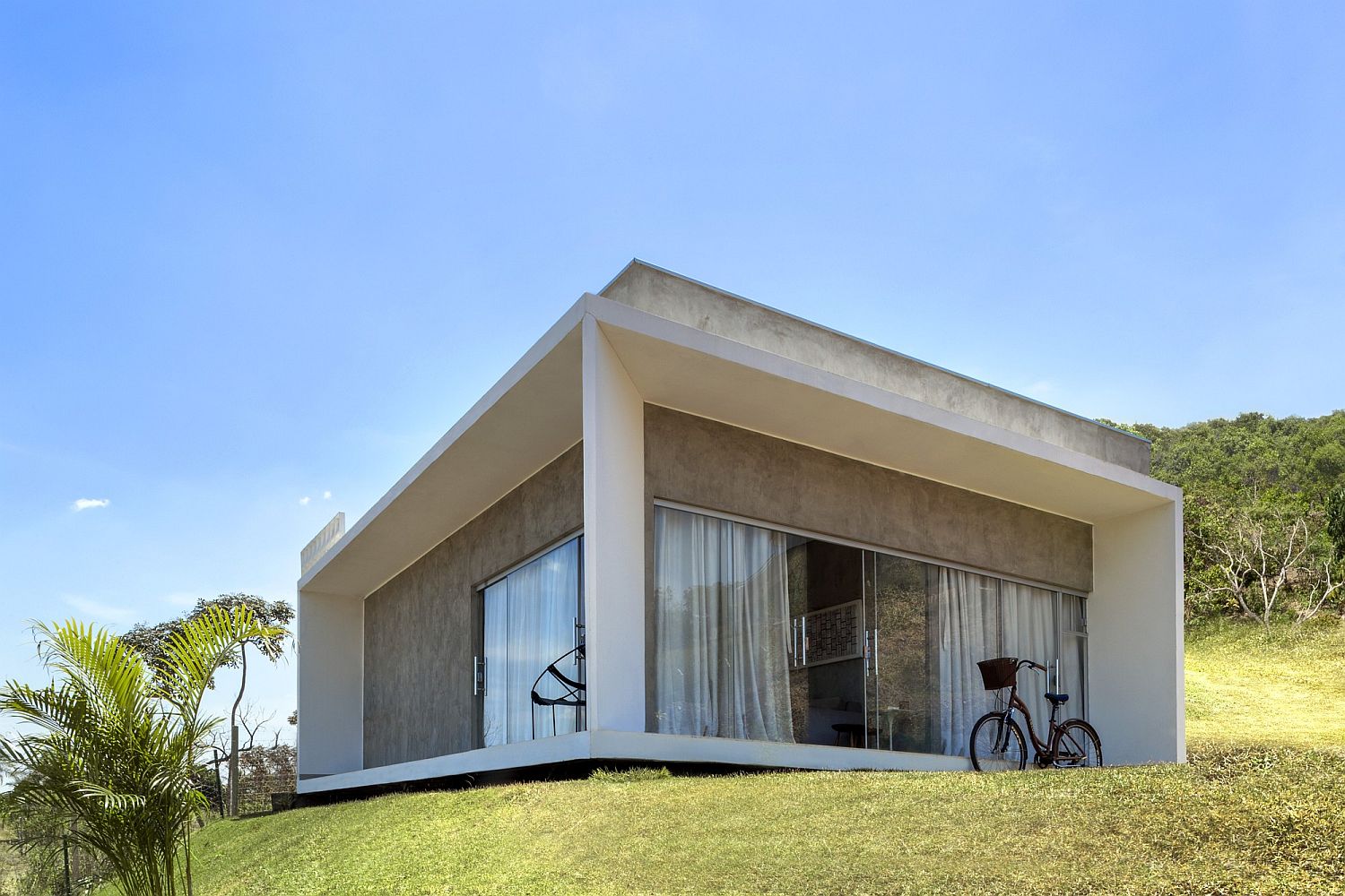 Minimal modern home with a lovely view of natural reserve in Brazil