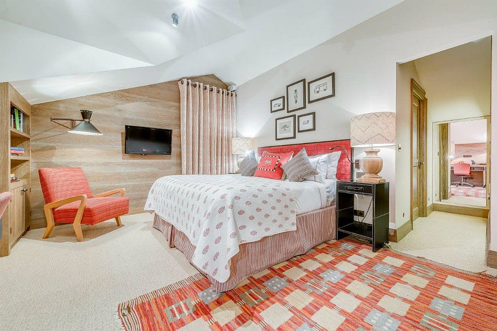 Modern bedroom inside the luxury chalet with pops of bright pink