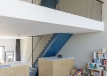 Multi-level-interior-of-the-blue-house-feels-impersonal-at-best-217x155