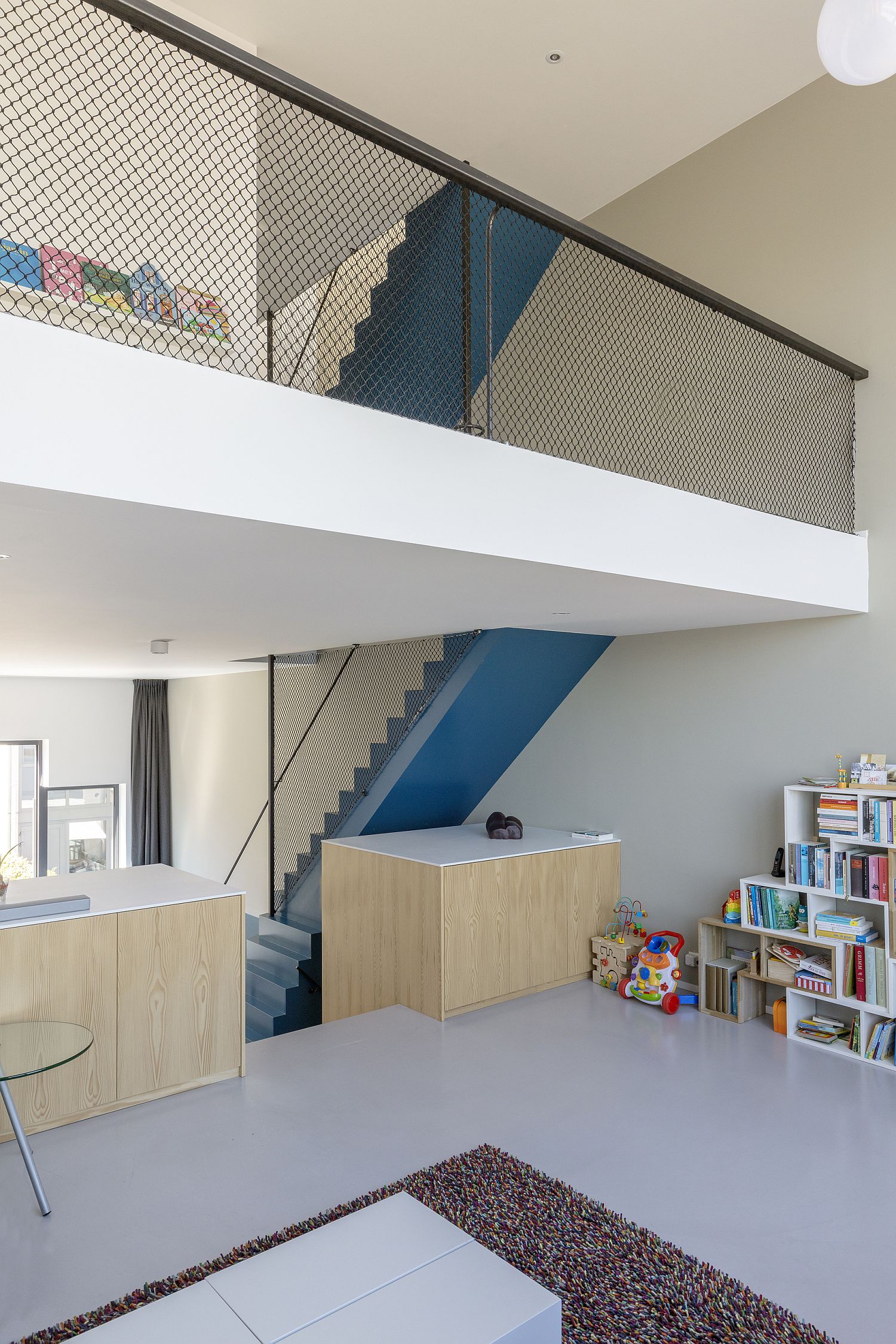 Multi-level interior of the blue house feels impersonal at best