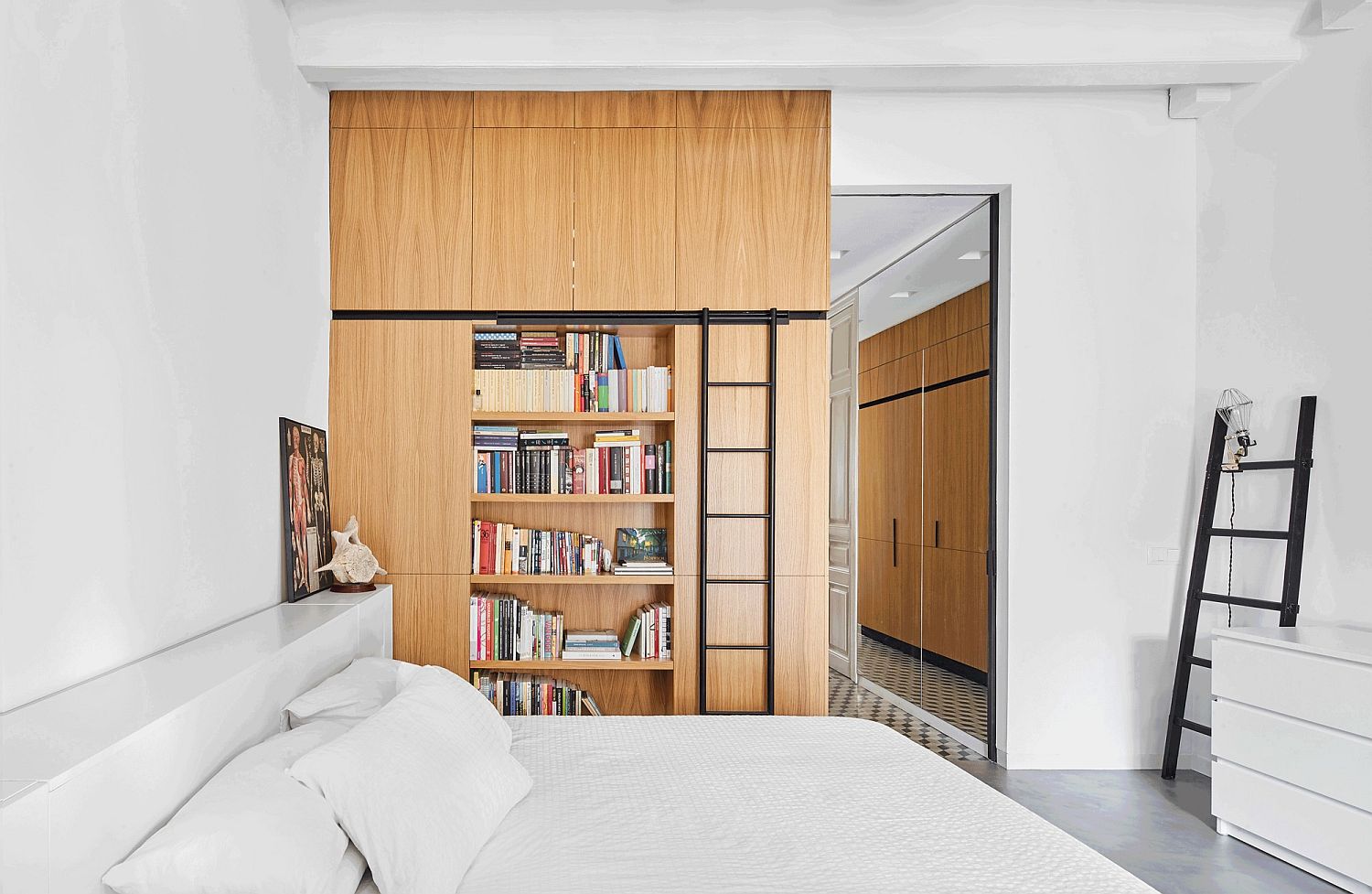 Oak cabinets and multi-tasking shelves are spread out in the apartment