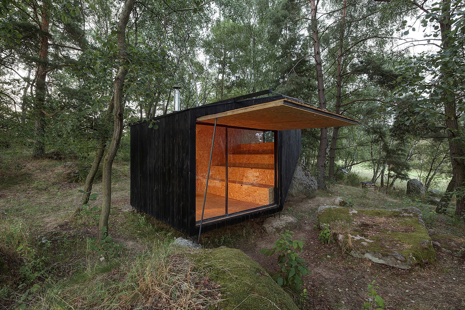 Opening up the cabin offers wonderful views of the woods outside