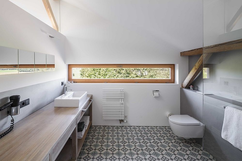 Polished and elegant bathroom in white and wood