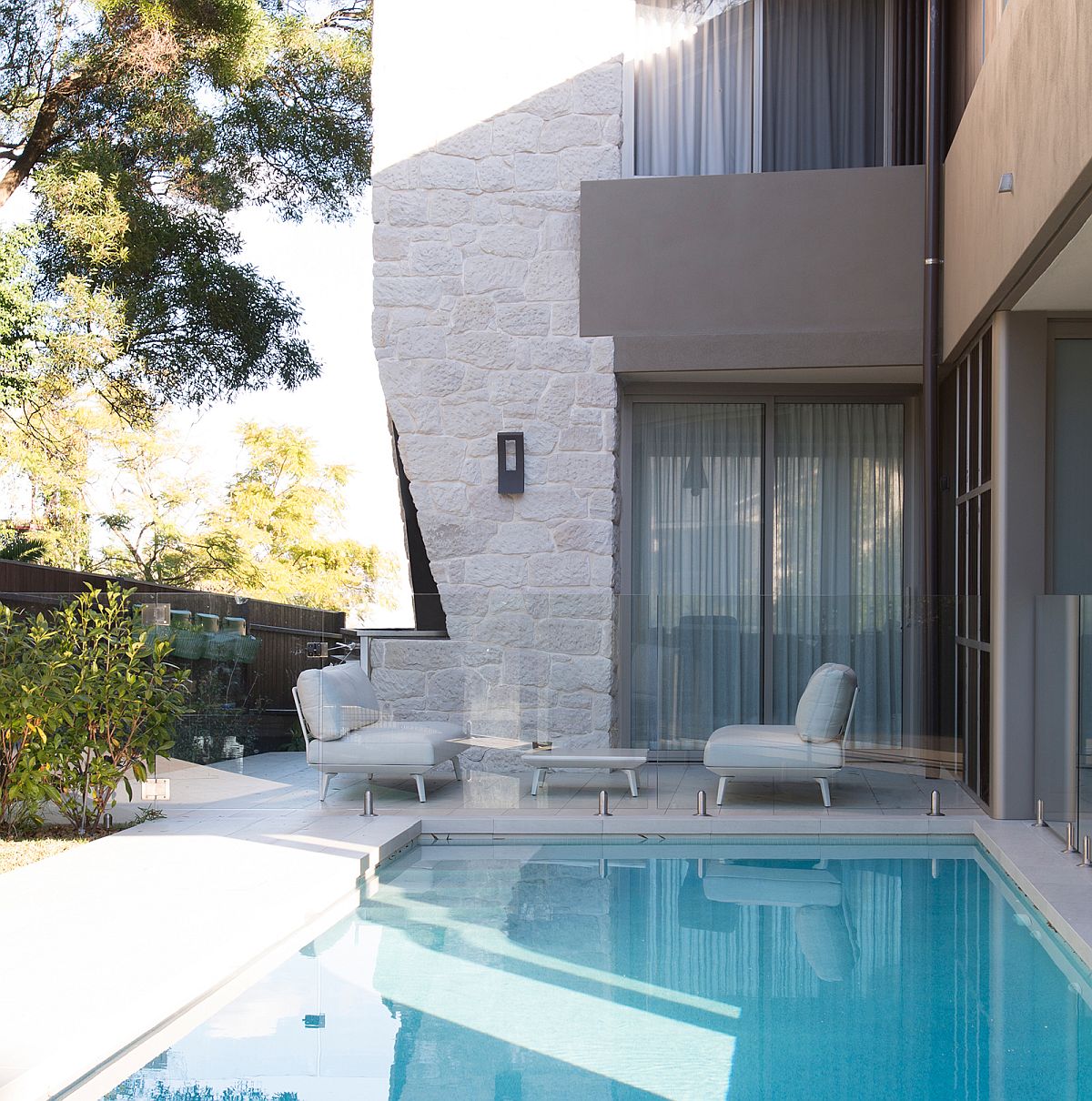 Pool are aaround the house along with sheltered sitting spaces