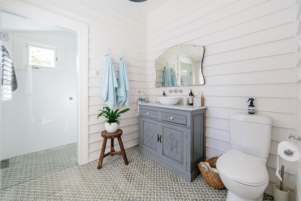 Shabby chic bathroom in white with corner wooden vanity