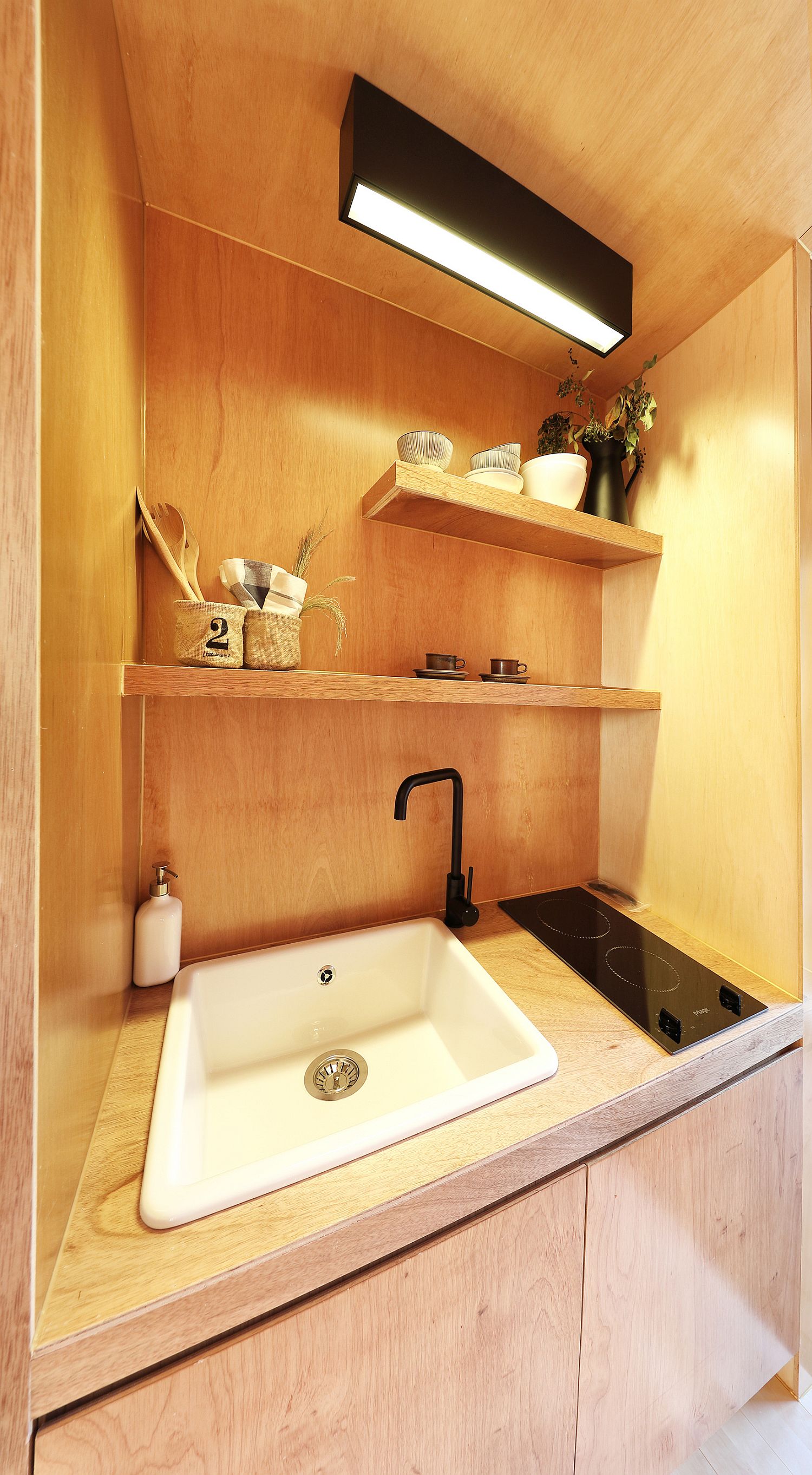 Sink, kitchen workstation and smart cabinets placed carefully to create a functional kitchen