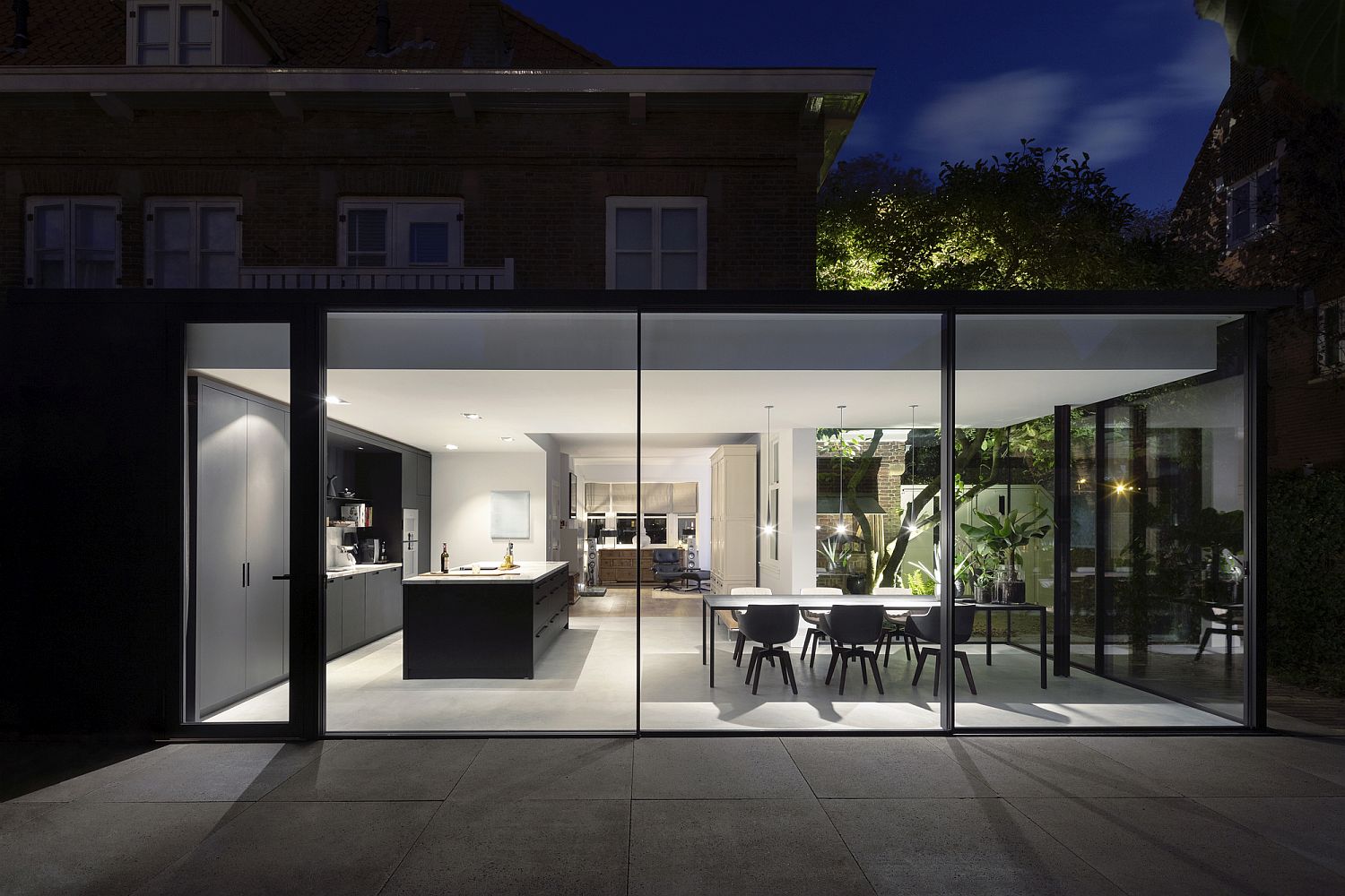 Sliding glass walls and doors for the modern extension of Dutch house