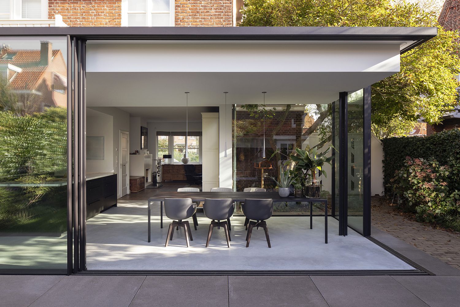 Sliding glass walls around the extension of the house