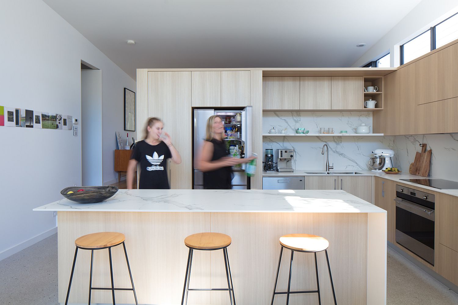 Smart and functional modern kitchen in wood and white with open shelving