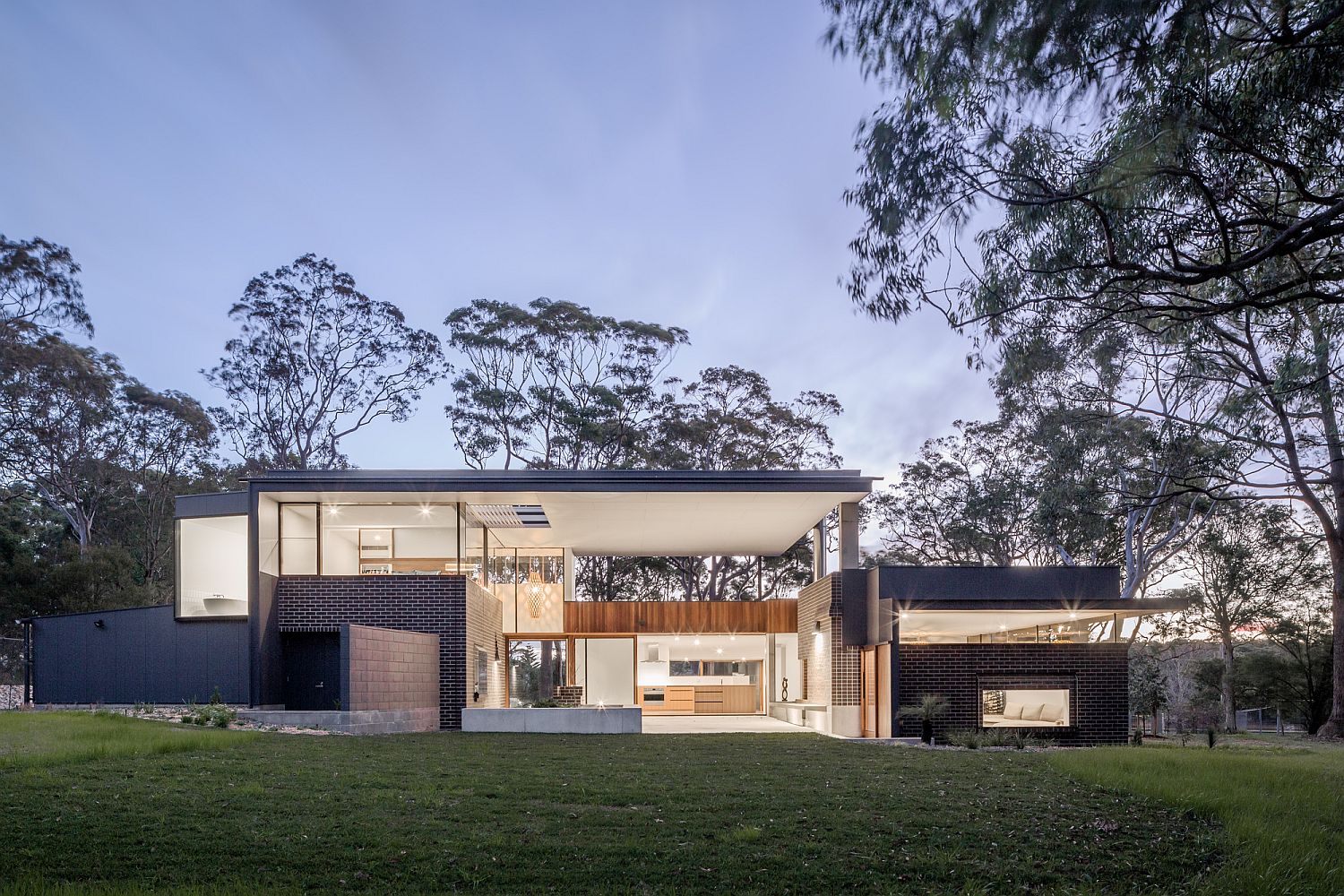 Smart and modern Aussie home overlooks the bushland and the distant coastline