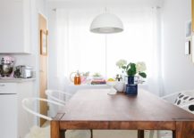 Smart-white-pendant-melts-into-the-white-backdrop-of-the-dining-room-effortlessly-217x155