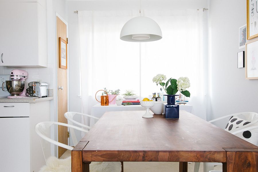 Smart white pendant melts into the white backdrop of the dining room effortlessly