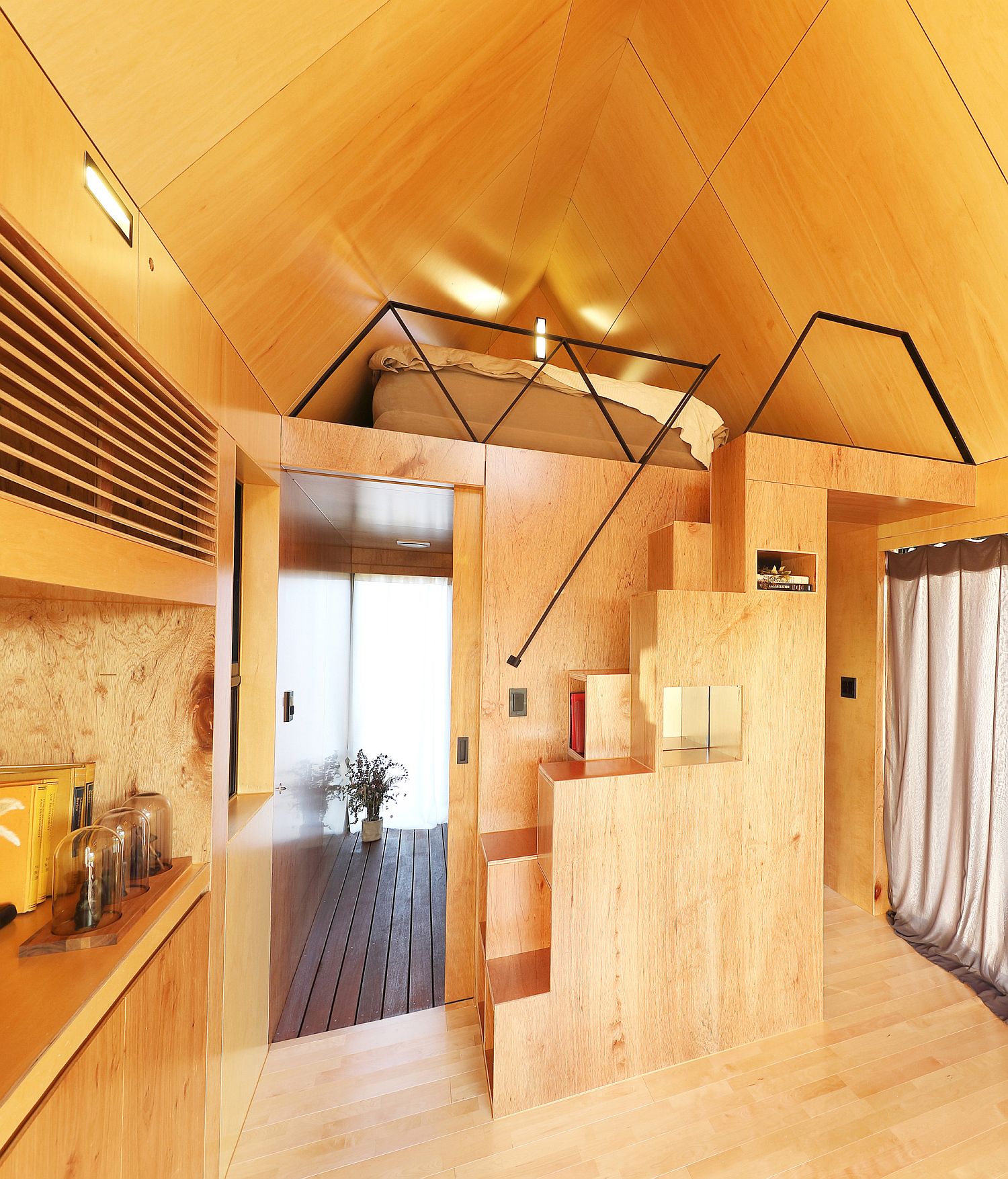 Steps-leading-to-the-loft-bedroom-with-storage-options