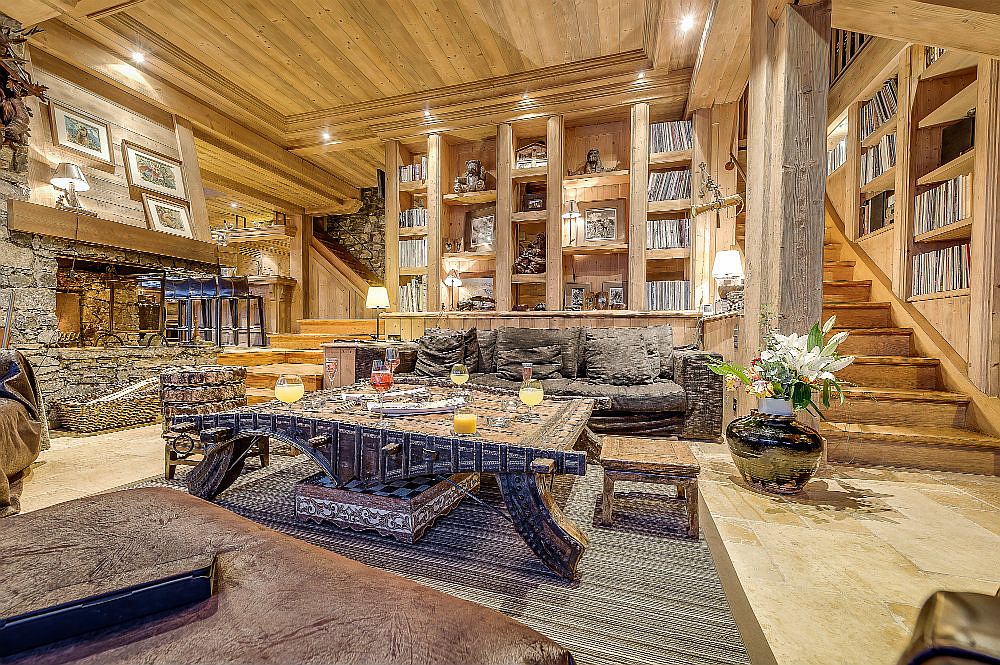 Stone and wood shape the stunningly beautiful interior of the chalet