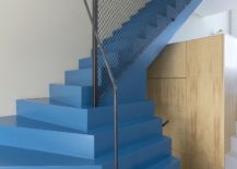 Striking-blue-staircase-with-mesh-railing-217x155