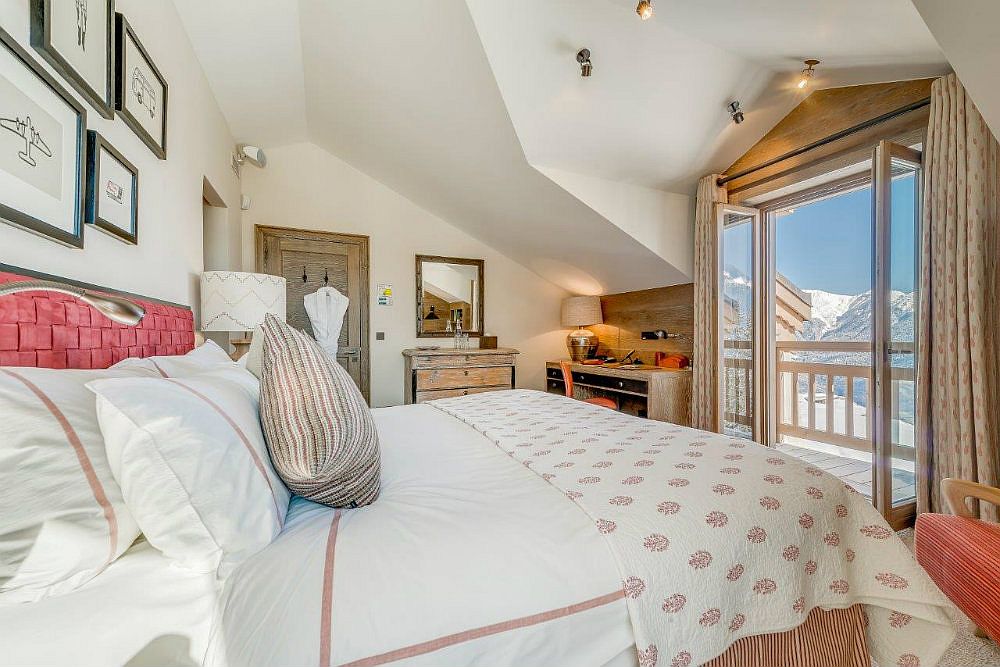 Take in the breathtaking beauty of French Alps from the bedroom of Shemshak Lodge