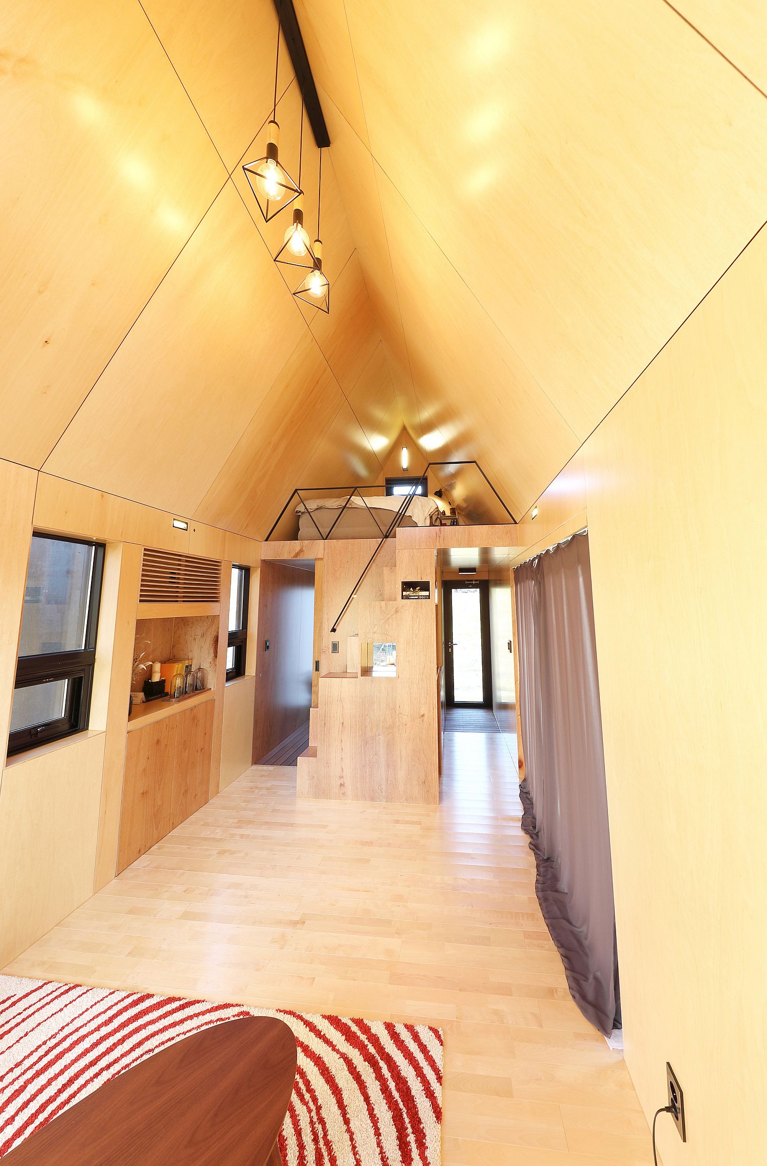 Tiny-House-with-loft-level-bedroom-in-wood