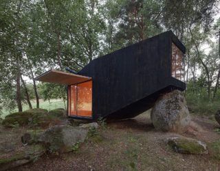 Discover Tranquility: Tiny Forest Retreat that Rests on Giant Boulders