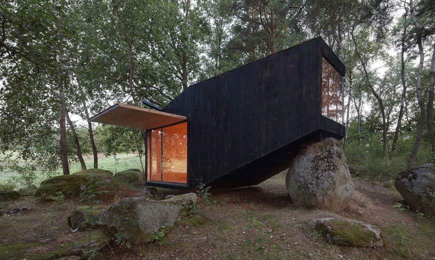 Discover Tranquility: Tiny Forest Retreat that Rests on Giant Boulders
