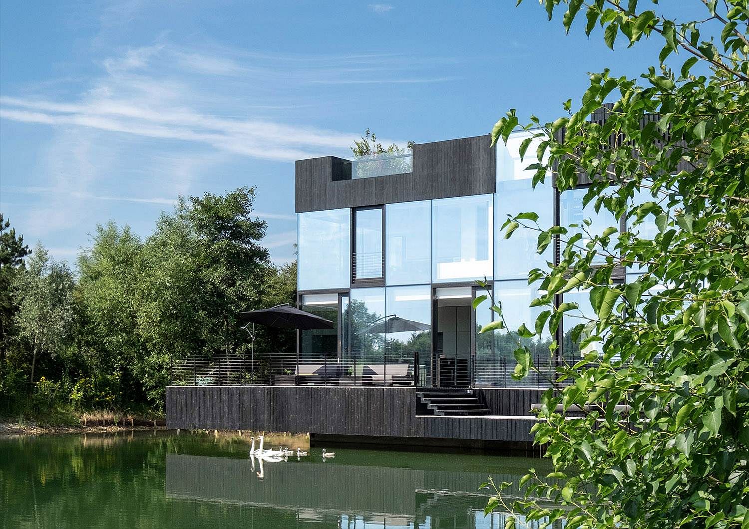 Villa on a Lake clad in glass