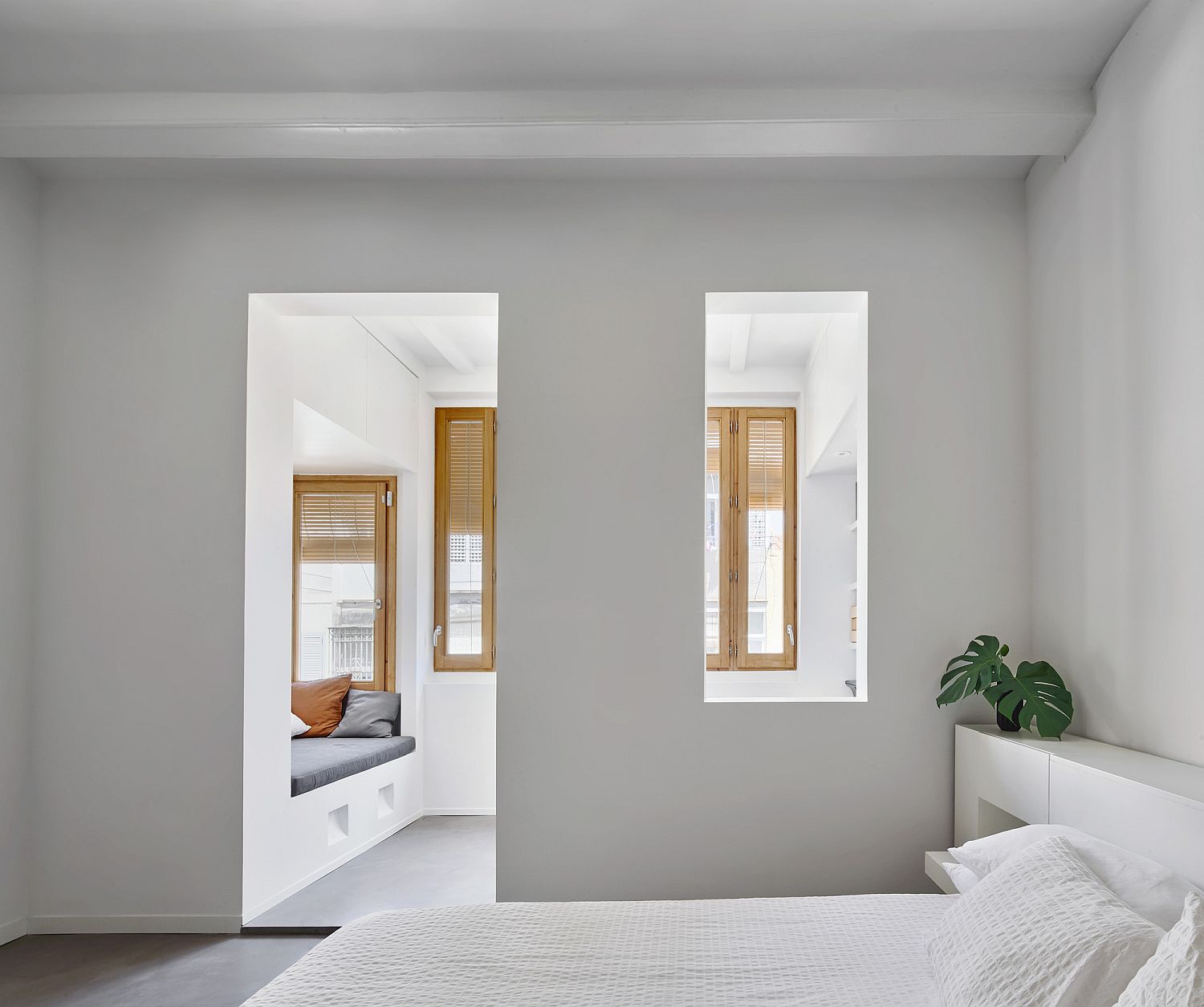 White and cheerful bedroom of modern apartment in Barcelona