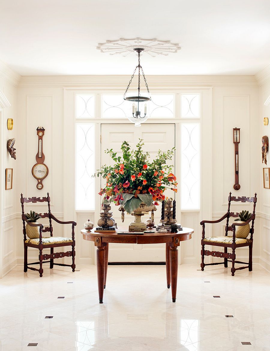 White and well-lit entry room with traditional wooden decor