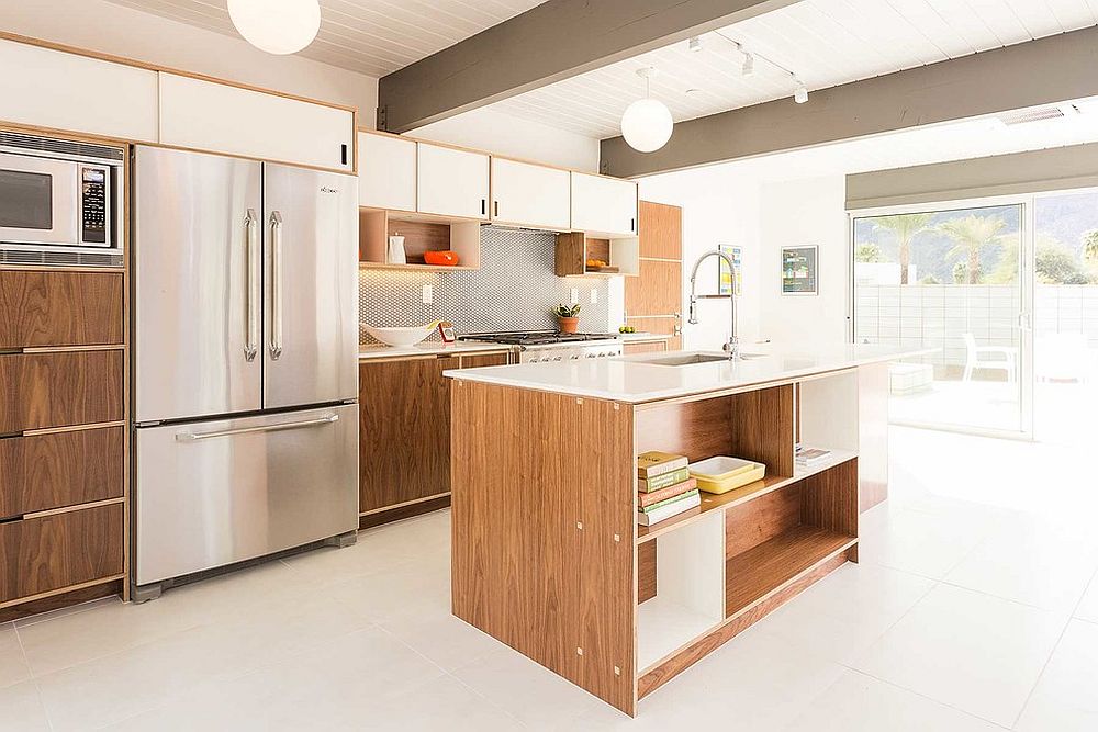 White and wood cabinets along with island perfectly fit into the midcentury style of the kitchen