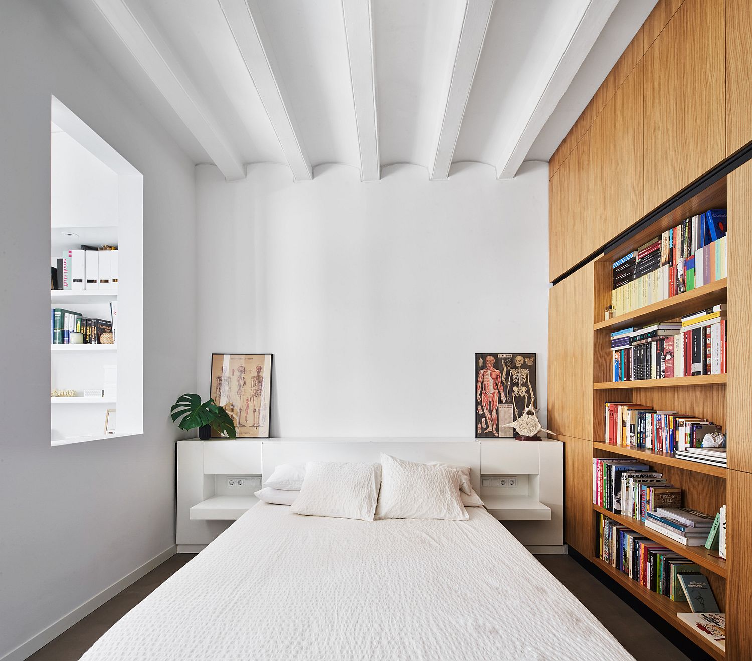 White bedroom with oak wooden cabinets and shelves