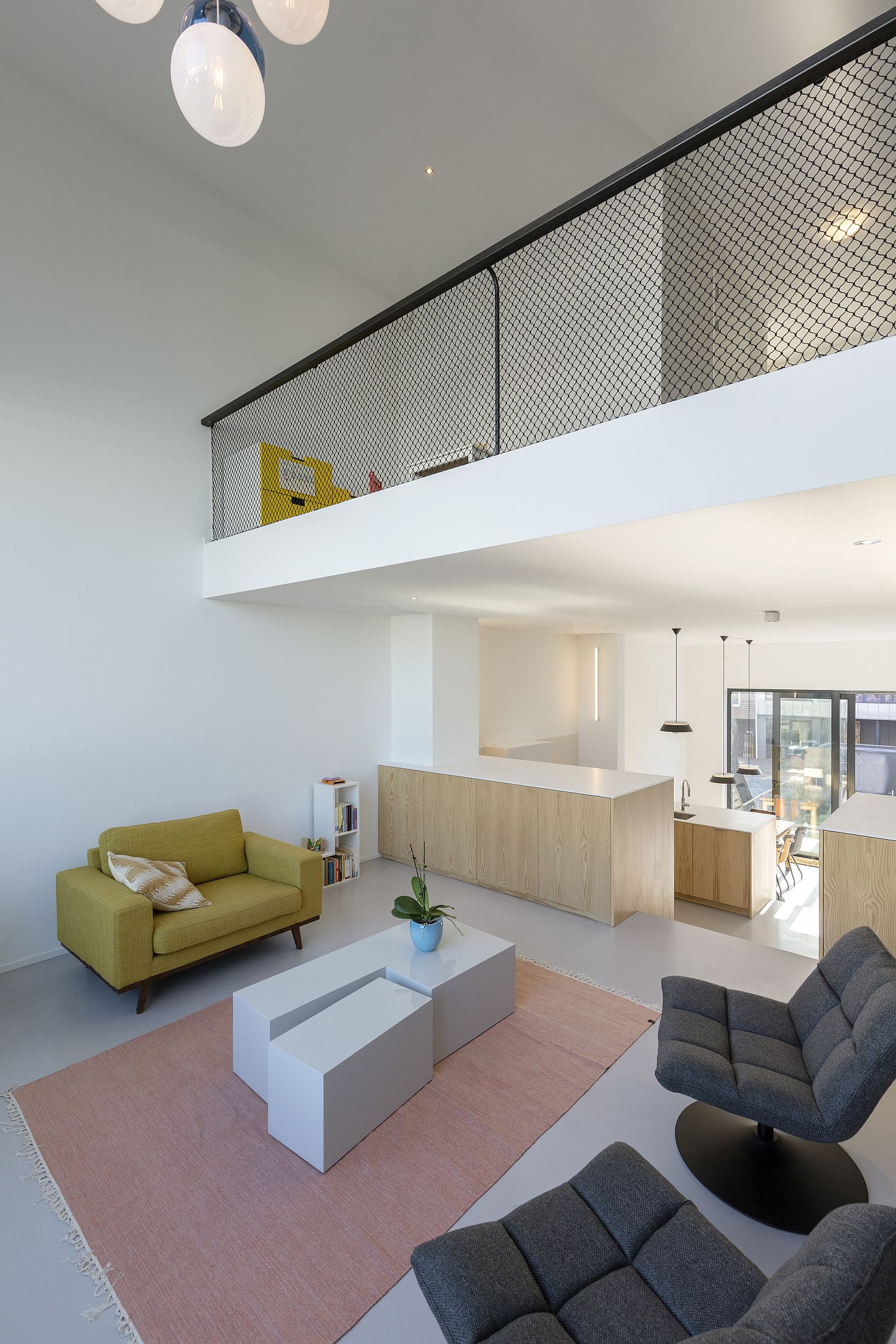 Wood and white shapes the living room of the Blue House