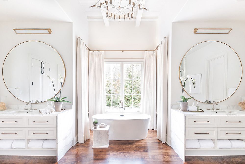 Wooden floor brings warmth to the all-white bathroom with metallic accents