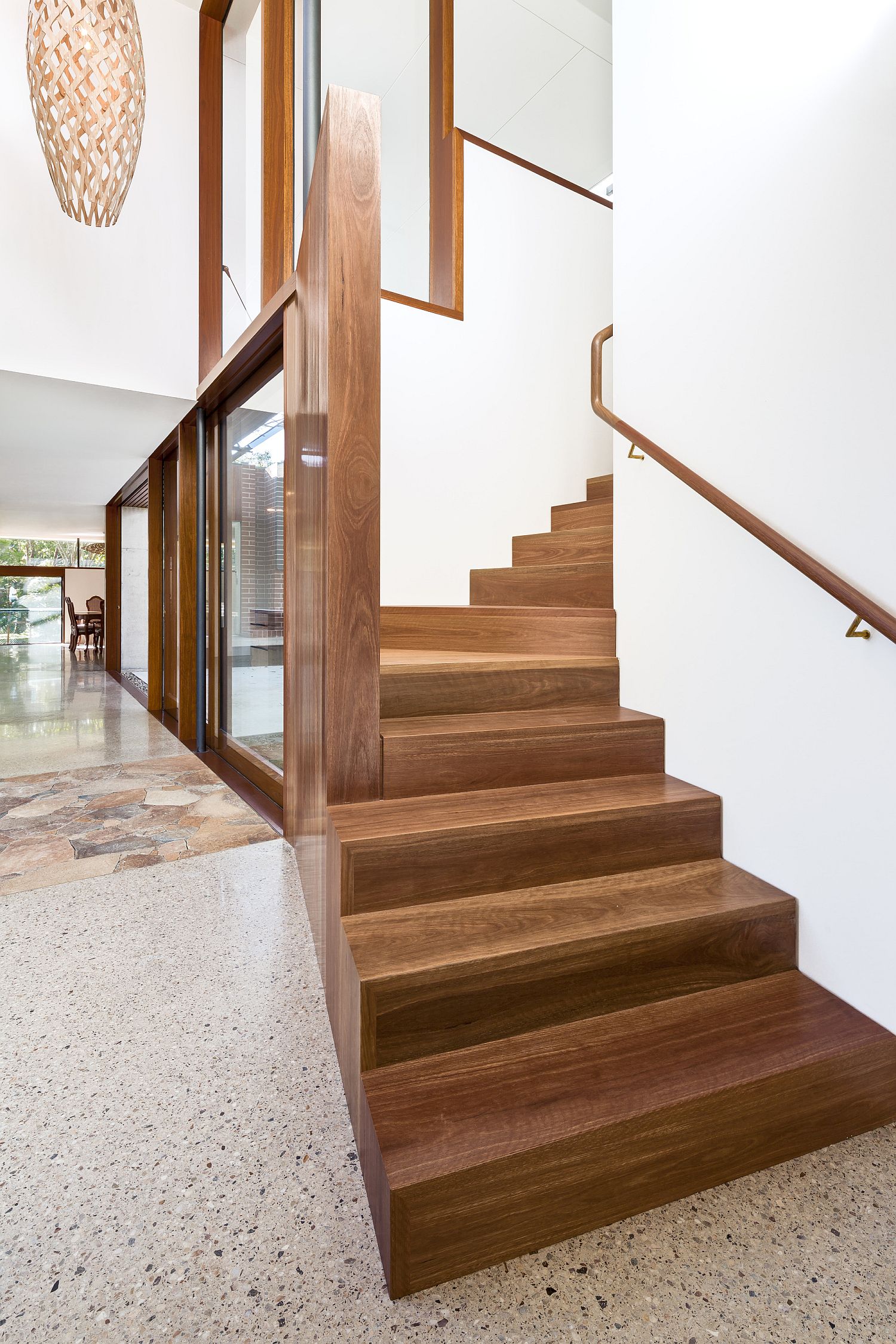 Wooden stairway connects the lower living area with the bedrooms