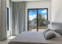 Beach-style-bedroom-in-white-and-gray-with-a-view-to-match-217x155