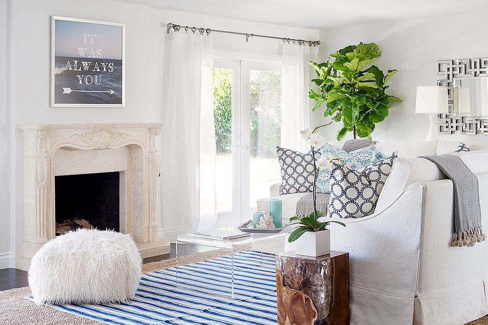 Beach style living room with white sheers that blend into the backdrop